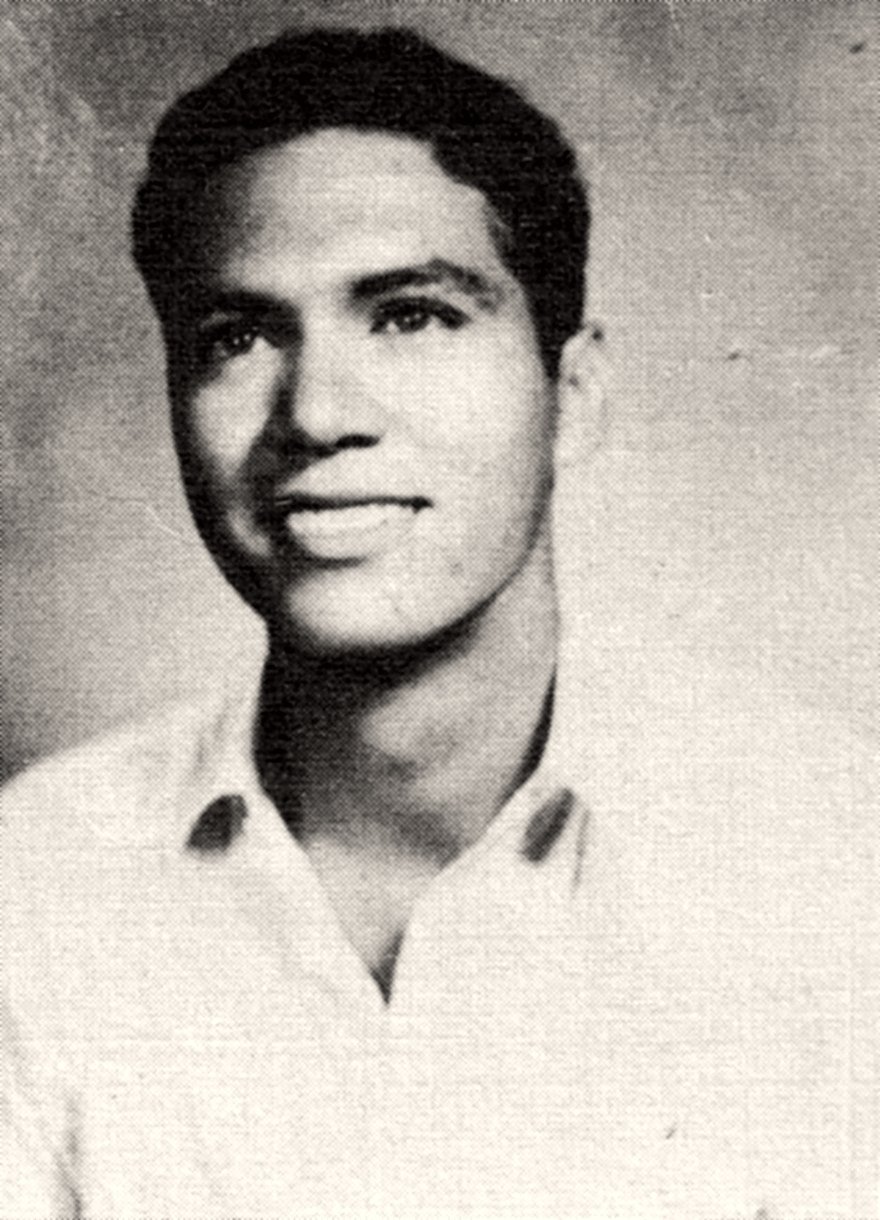 Black-and-white yearbook portrait of a young Arturo Campos, smiling